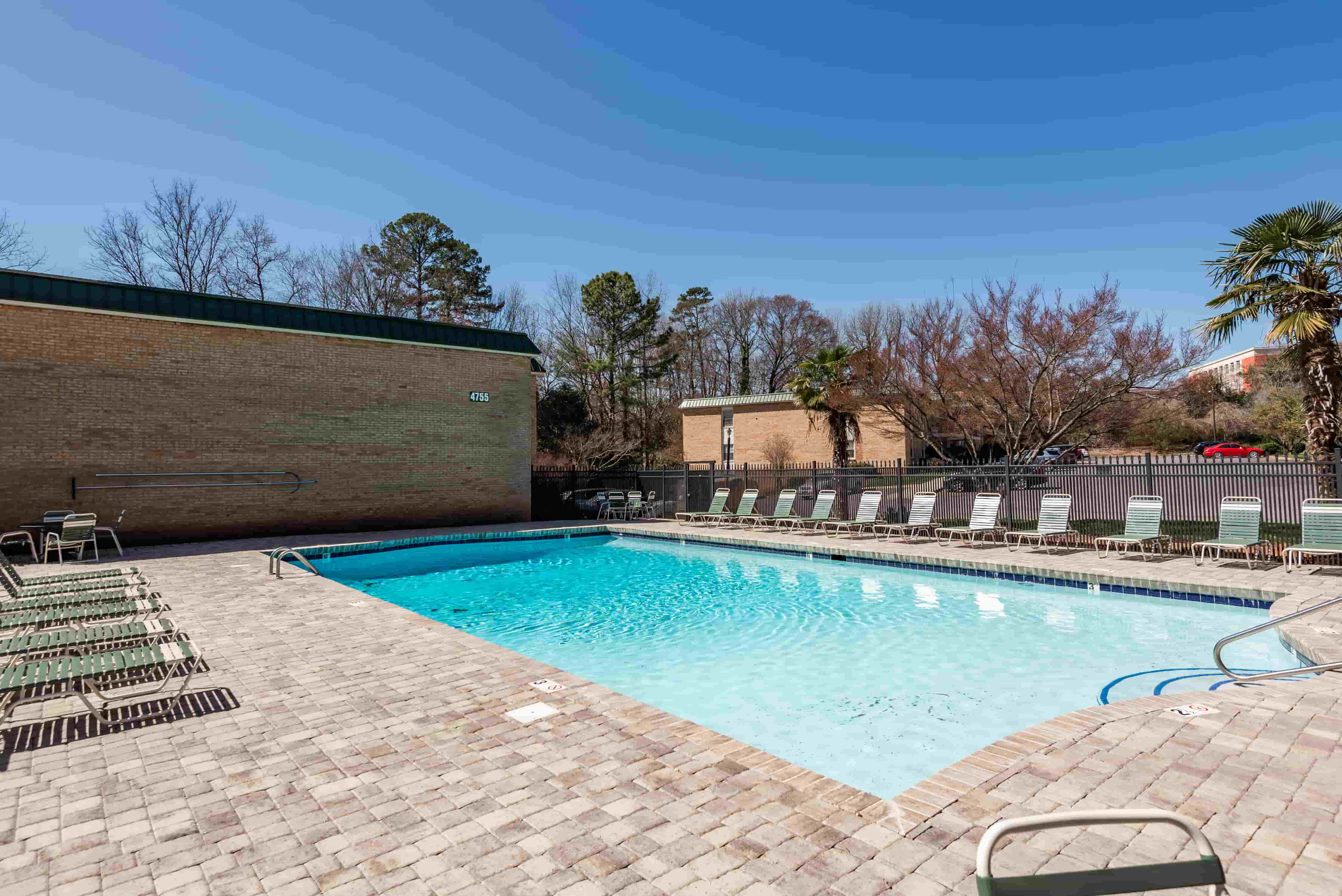 Franciscan Terrace pool — south-facing, full-size, with paver deck and lounge seating
